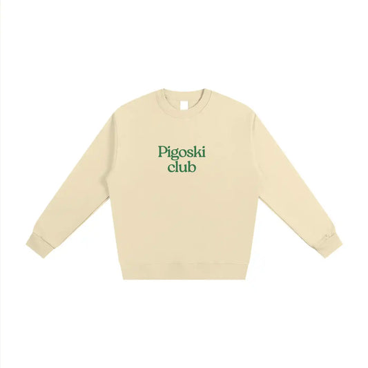 Beige sweatshirt with 'Pigoski club' text in green on a white background