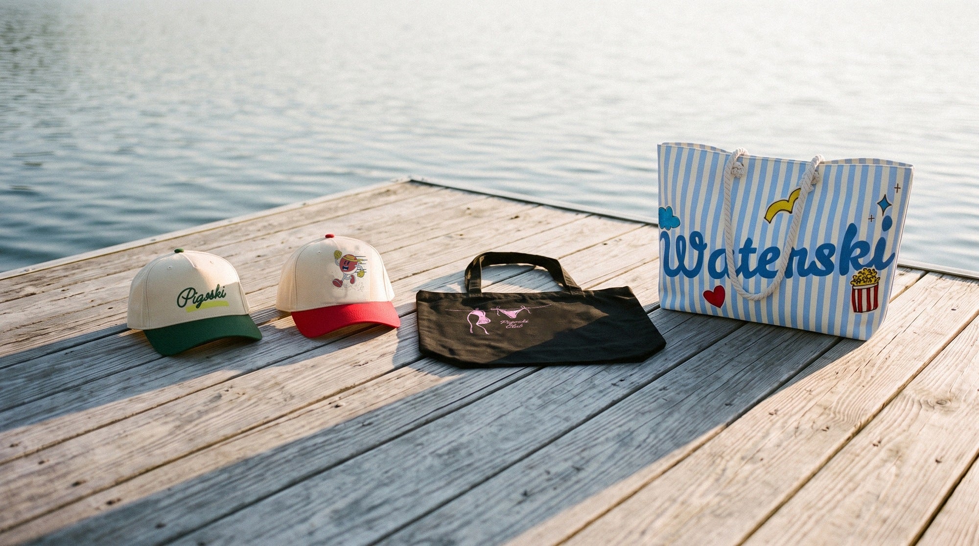 PIGOSKI accessories on the dock at golden hour - Pigoski caps, Pigoski Club tote and Waterski weekender