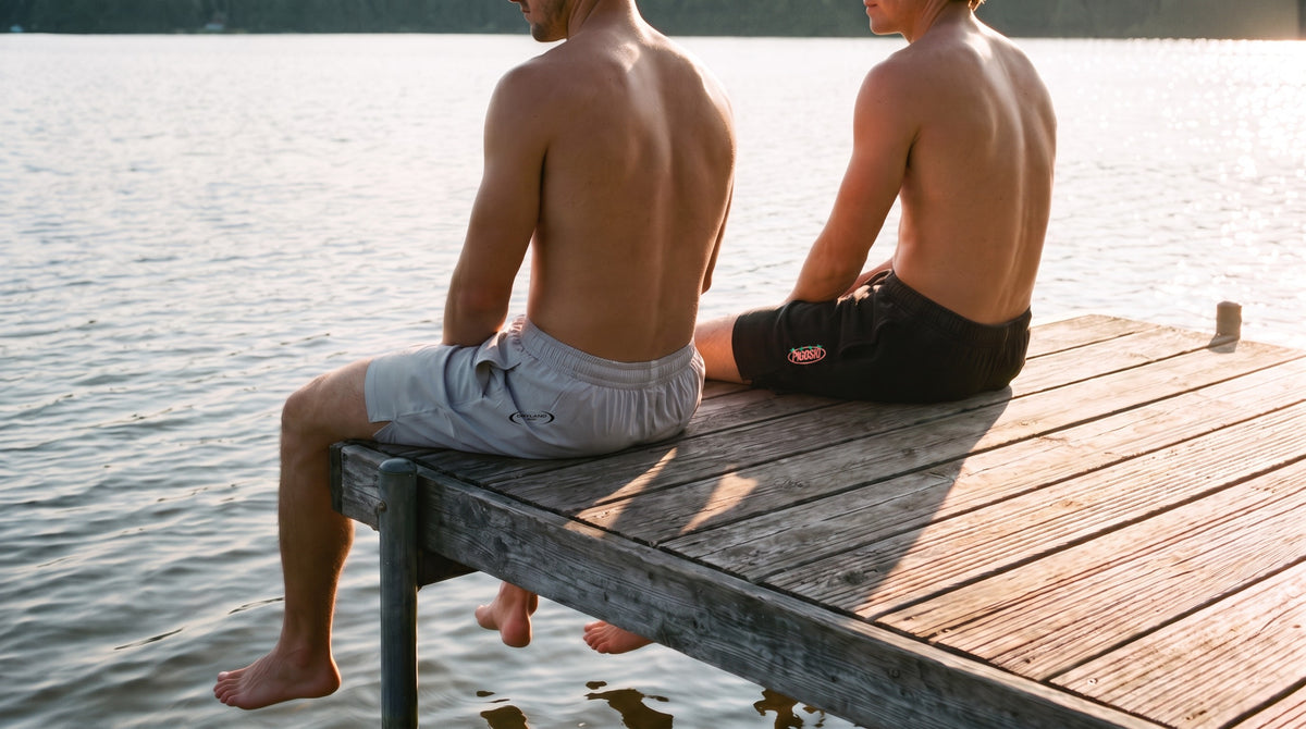 Two models on the dock edge in PIGOSKI Dryland Oval and Rockstar shorts — Shorts and Pants collection banner