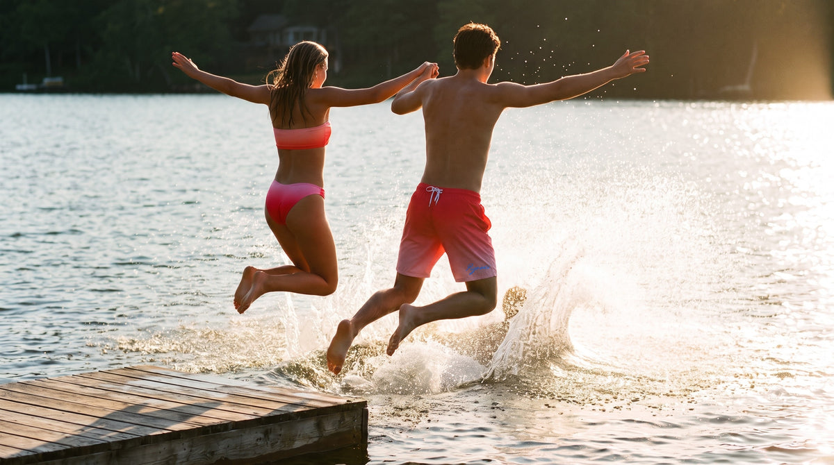 Two friends jumping off the dock into the lake in PIGOSKI Rose Fuse swim — Swim collection banner