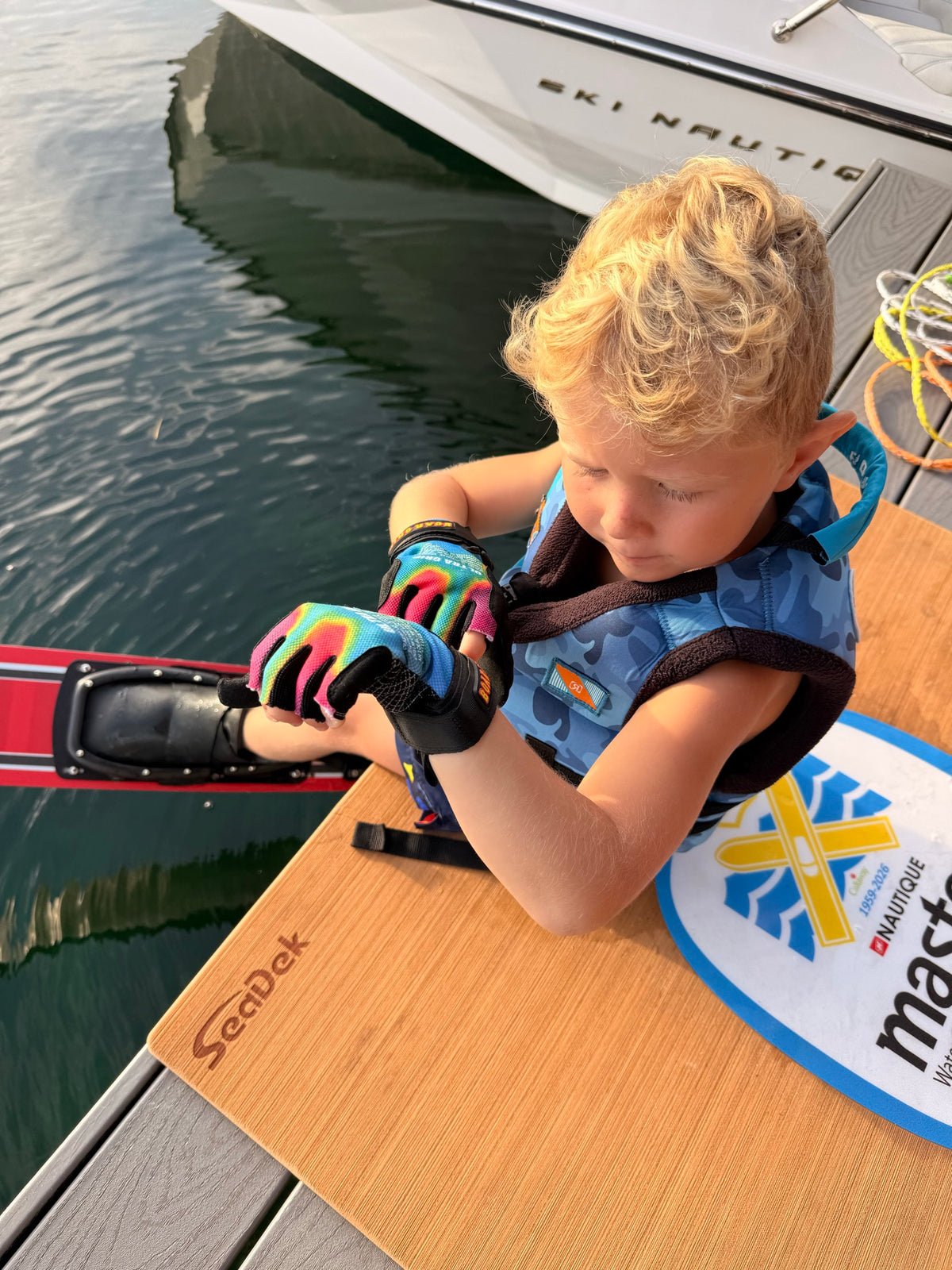 Zane Rini fastening the PIGOSKI Kids Ultra Grip Acid Wash glove