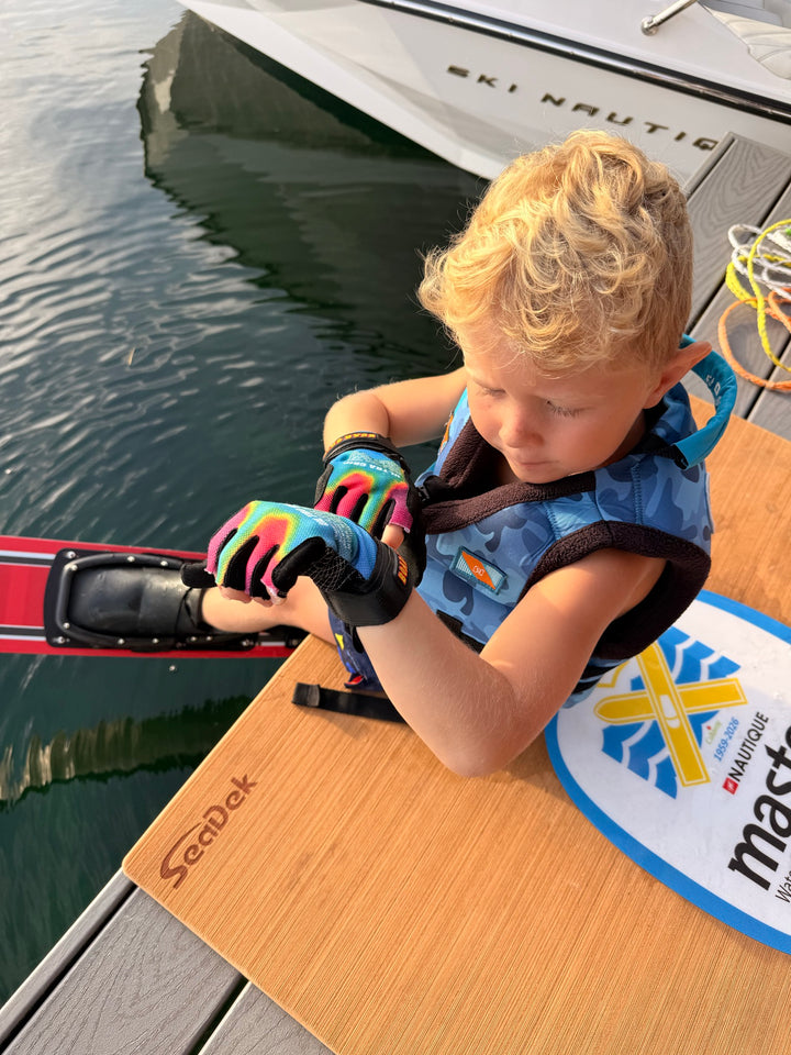 Zane Rini fastening the PIGOSKI Kids Ultra Grip Acid Wash glove