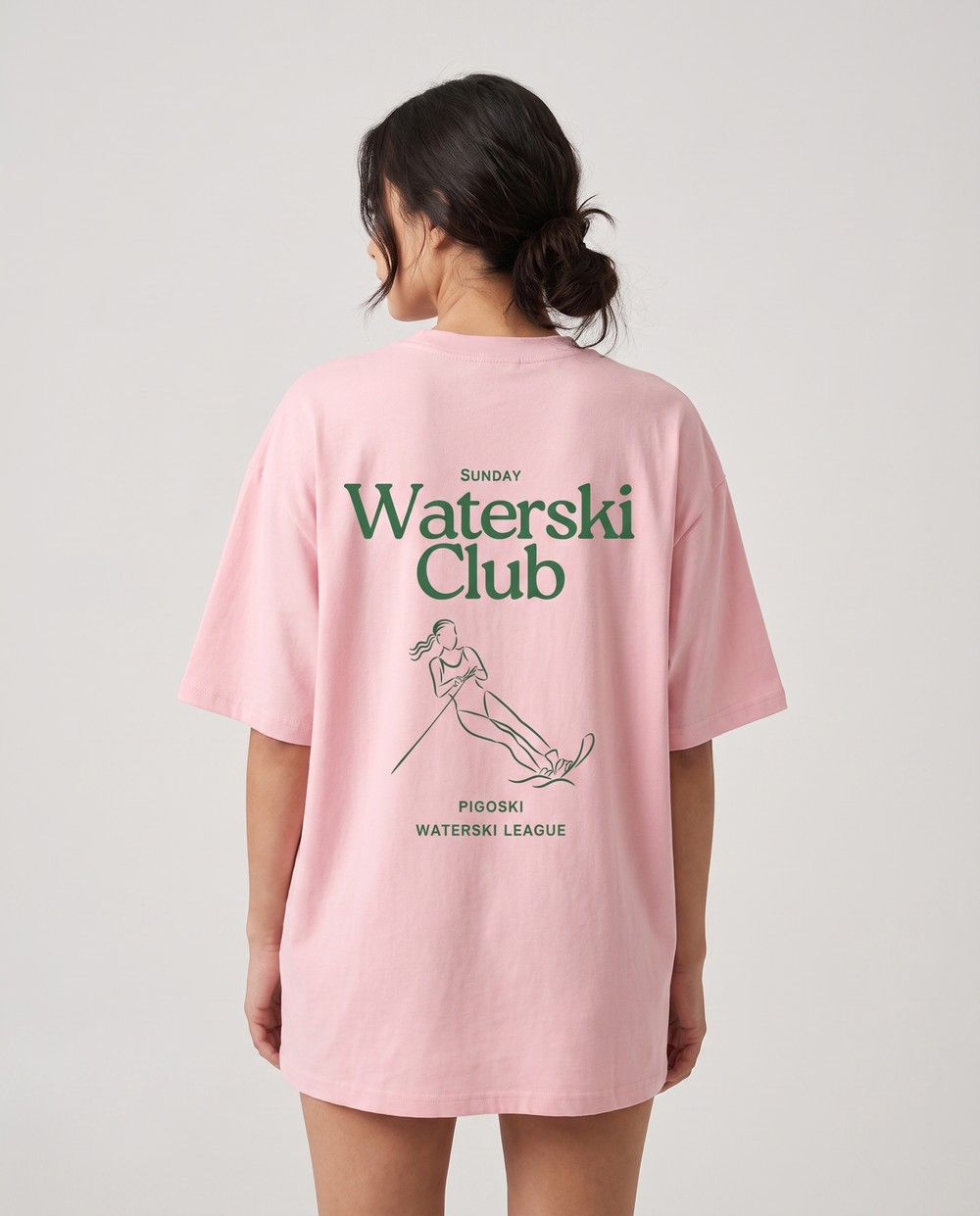 PIGOSKI Club Tee — Pink on model — studio fit shot