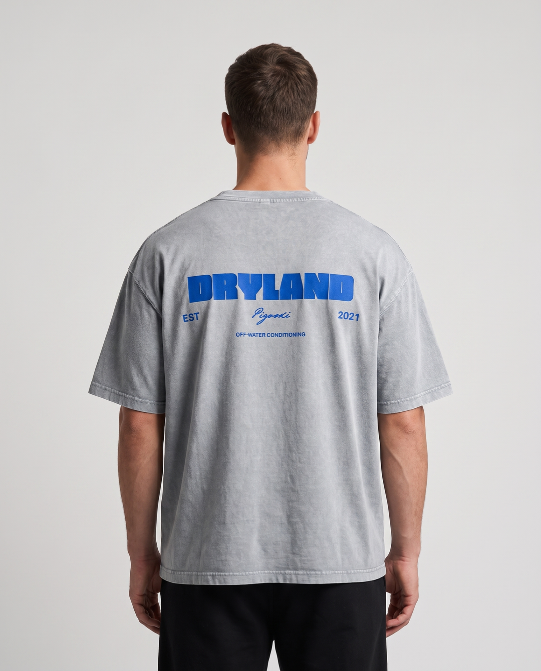 PIGOSKI Dryland Est. 2021 Boxy Tee — Mineral Wash on model — studio fit shot