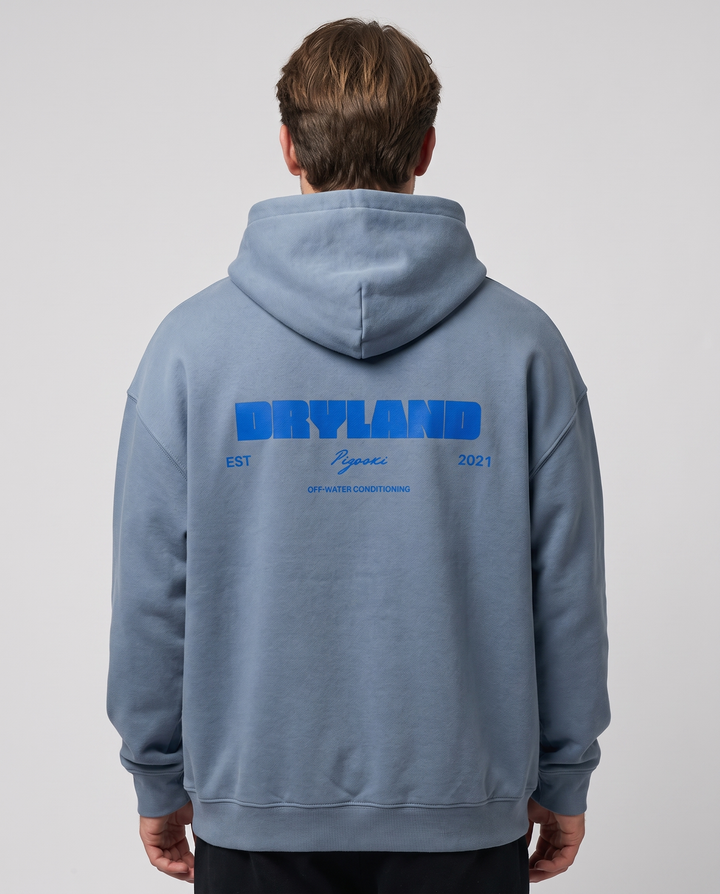 PIGOSKI Dryland Signature Fleece Hoodie — Oversized on model — studio fit shot