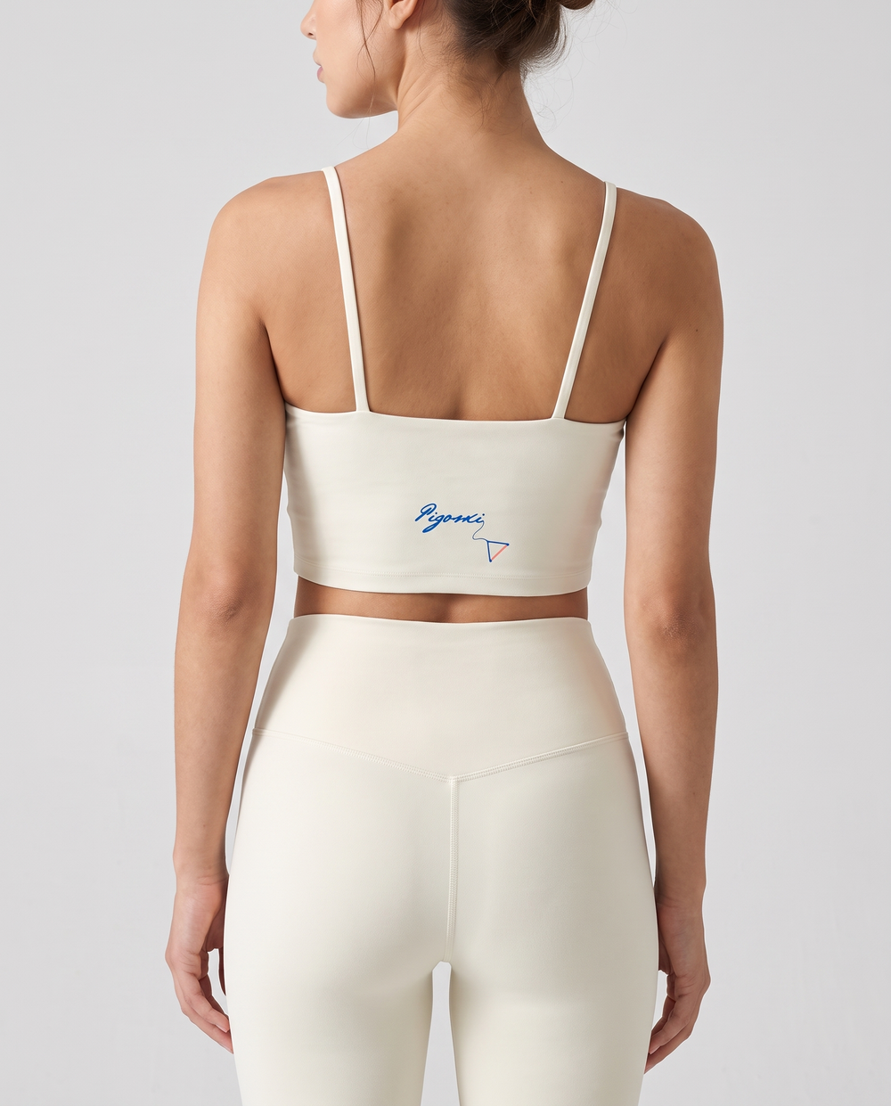 PIGOSKI Signature Spaghetti-Strap Yoga Bra — Women's on model — studio fit shot, back logo