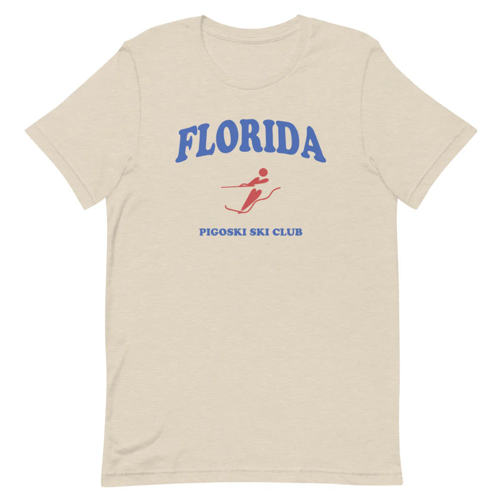 Beige t-shirt with 'Florida' and 'Pigoski Ski Club' text and graphic on a white background